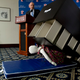 Consumer Product Safety Commission (CPSC) Chairman Elliot Kaye watches a demonstration of a child dummy being crushed at a news conference Tuesday (Associated Press)